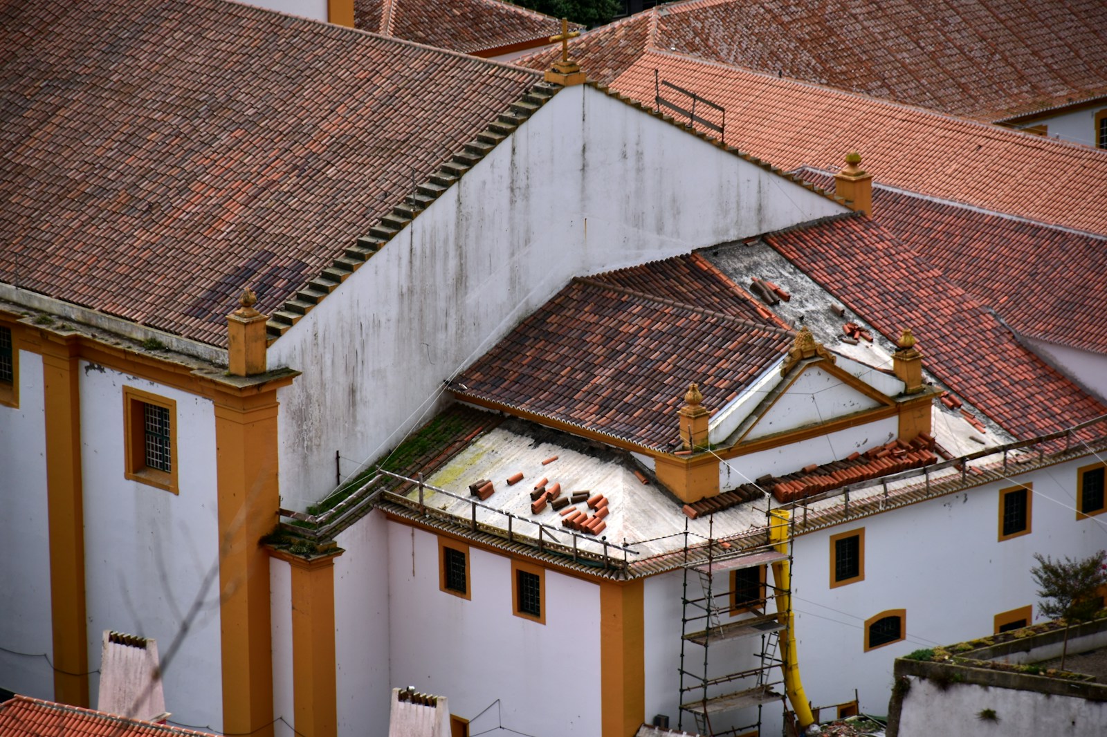 a view of a building with a lot of roof tiles