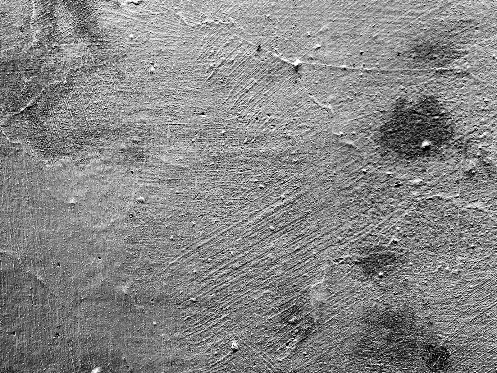 a black and white photo of a textured surface